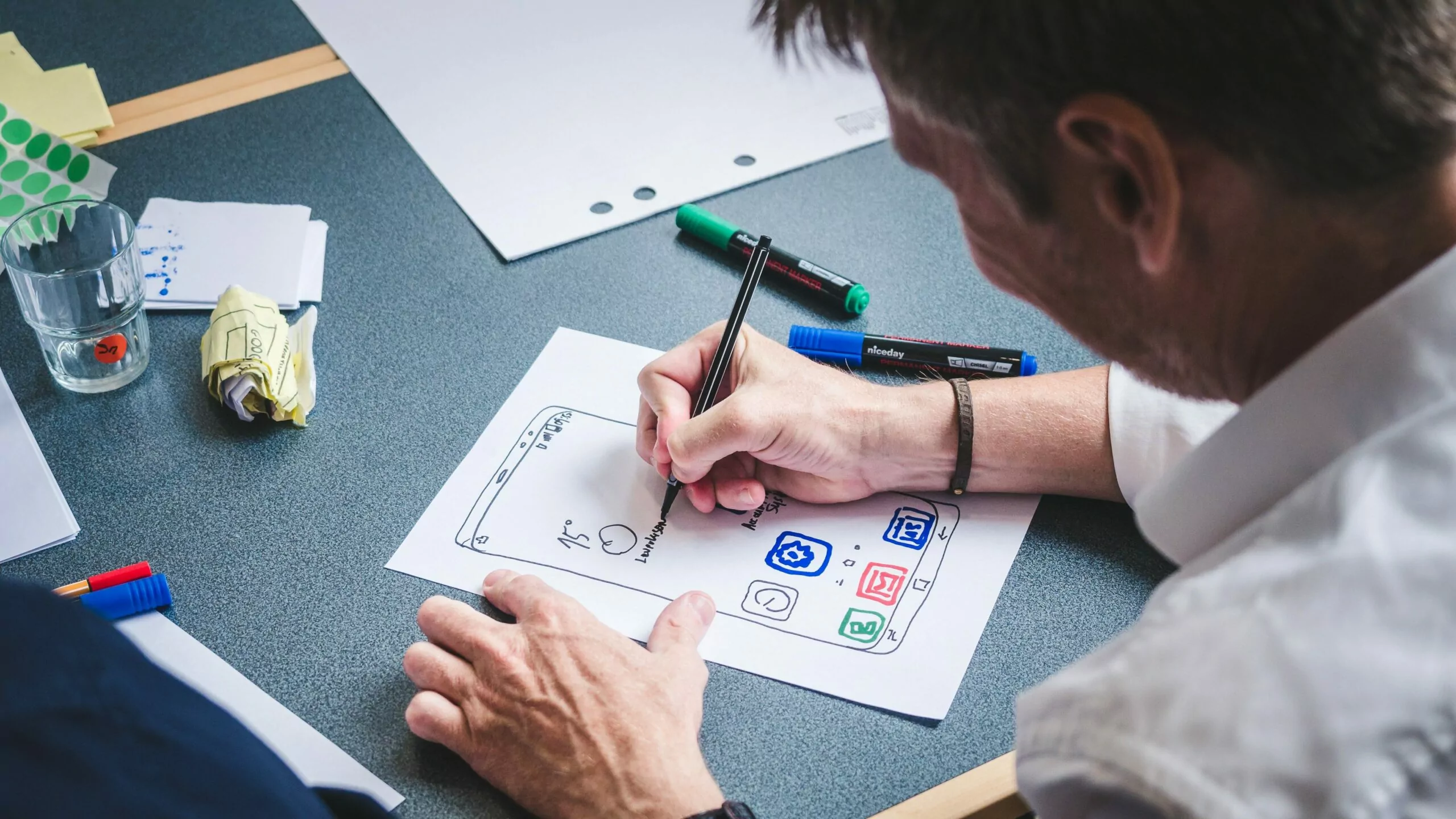 A Person Using A Laptop To Design A Website With A Focus On Ux